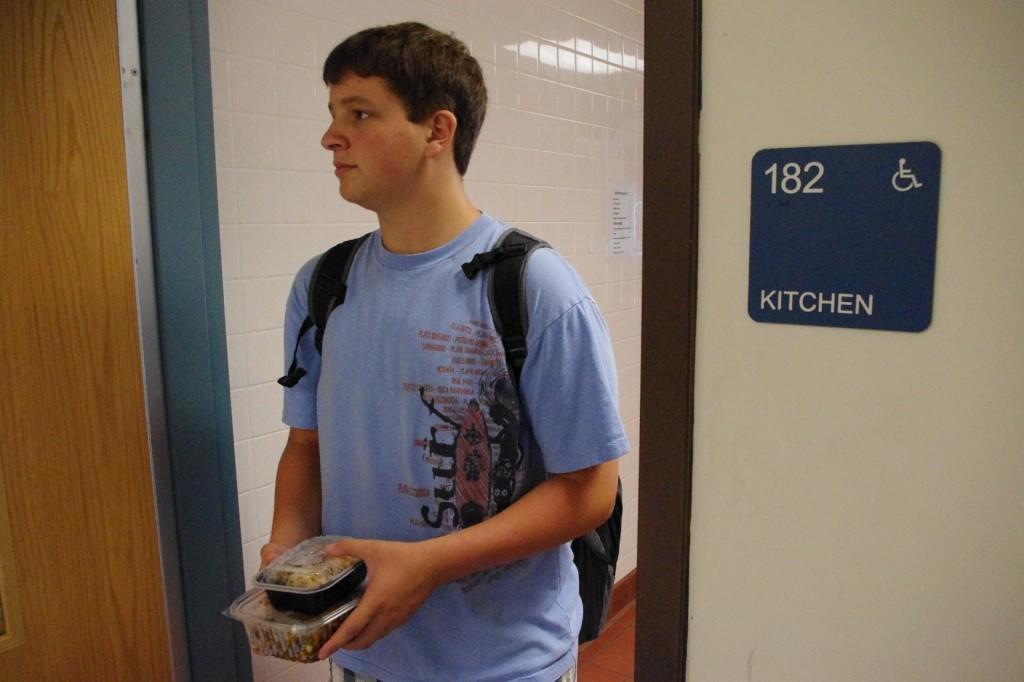 Andrew Fishman, '12, leaves his culinary classroom with contained food-- the only acceptable option for travelling food. Photo by Bryan Schiavone