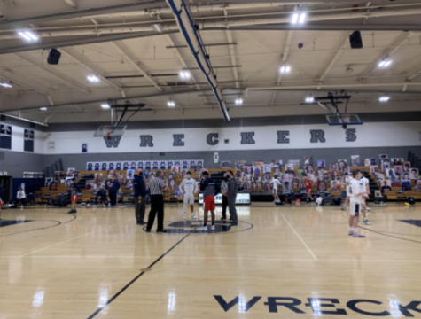 Staples warms up before the tip off against Brian McMahon. There are no fans in the gym. 