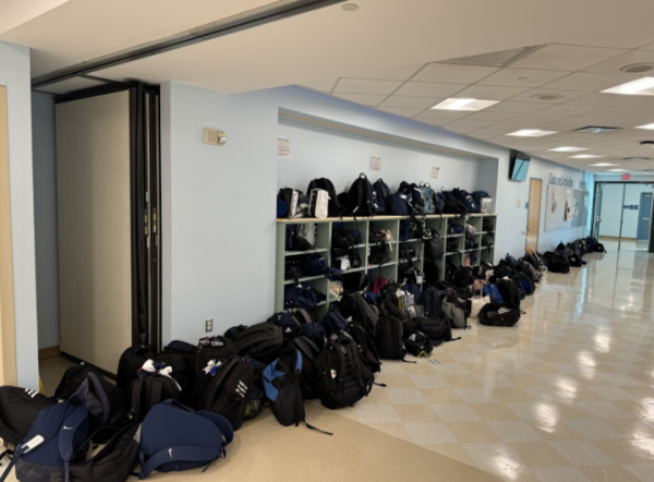 Athletic bags pile over the cafeteria floor on Monday morning, outnumbering the cubby slots. 