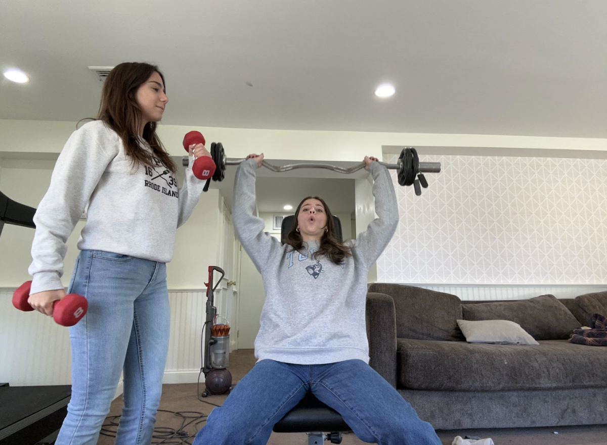 Girls weight lift at home to avoid potential unwanted remarks or instances of harassment. Samantha Sandrew ’25 (pictured right) and Siena Petrosinelli ’25 (pictured left) have had lots of experience in the gym over their lives, but often resort to working out at home to steer clear of the dangers at a public gym.