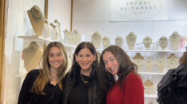 Rachel Reinhardt alongside her two daughters at the market 