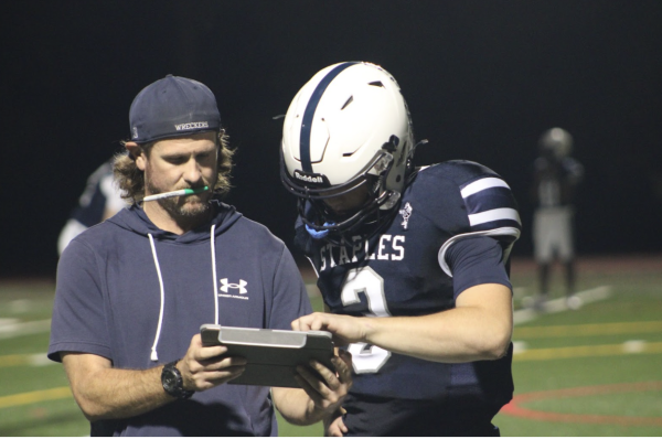 Staples football head coach Adam Behrends (left) will head west to coach for the University of New Mexico Lobos. 